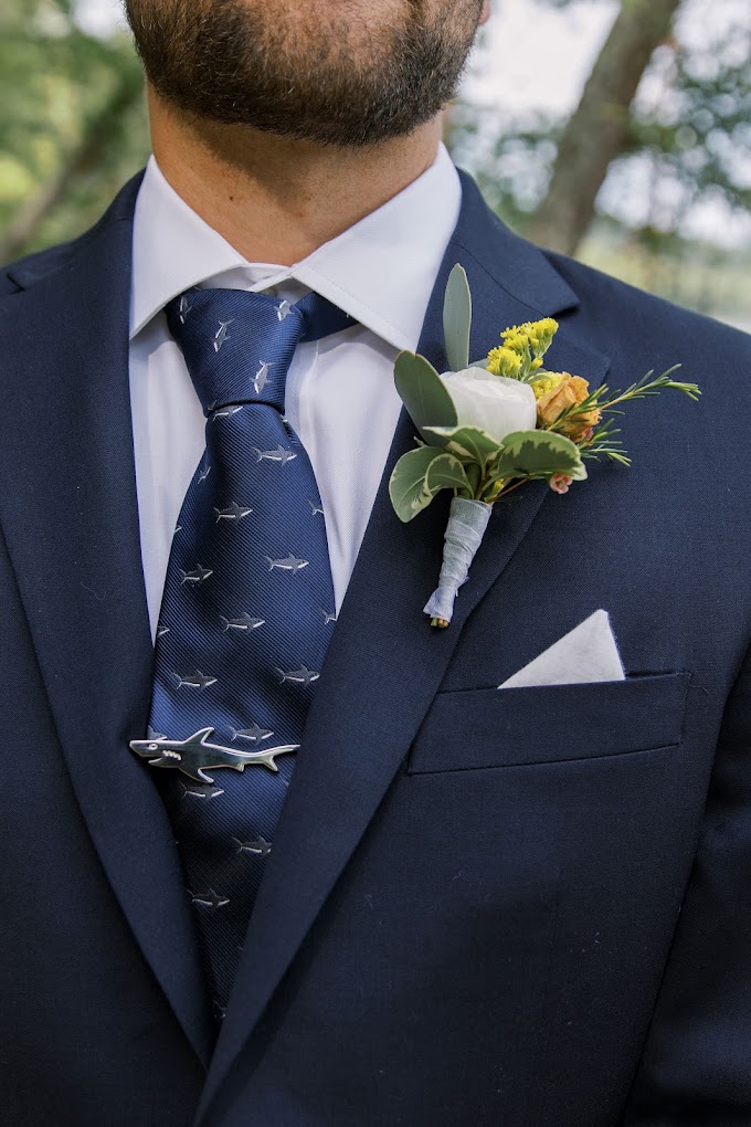 zoomed-in shot of man wearing boutonniere