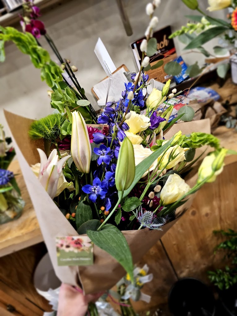 colorful bouquet in brown paper